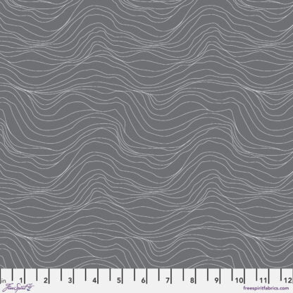 Natural Affinity Terrain in Fossil features thin white striations on a slate grey background. The wavy lines run parallel to the selvage edge.