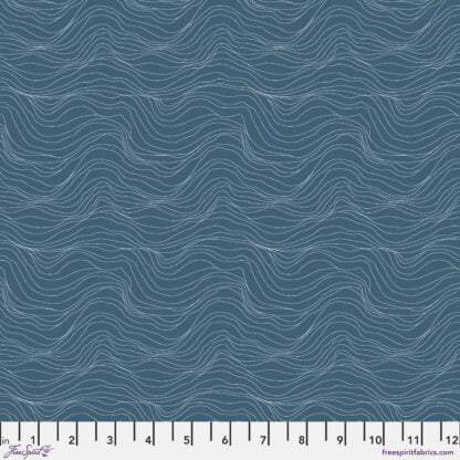 Natural Affinity Topography in Azure features thin white striations on a slate blue background. The wavy lines run parallel to the selvage edge