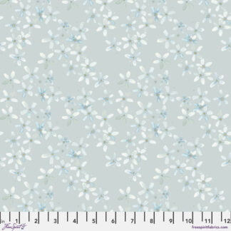 Natural Affinity Petals in Fog features small delicate watercolor flowers in soft white, blue, and green pastels tossed across a soft grey background.