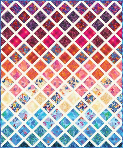 The Leaflet Stained Glass Quilt Kit is a dynamic blend of warm and cool-toned fabrics accented with a light neutral sashing that really makes these colors pop!